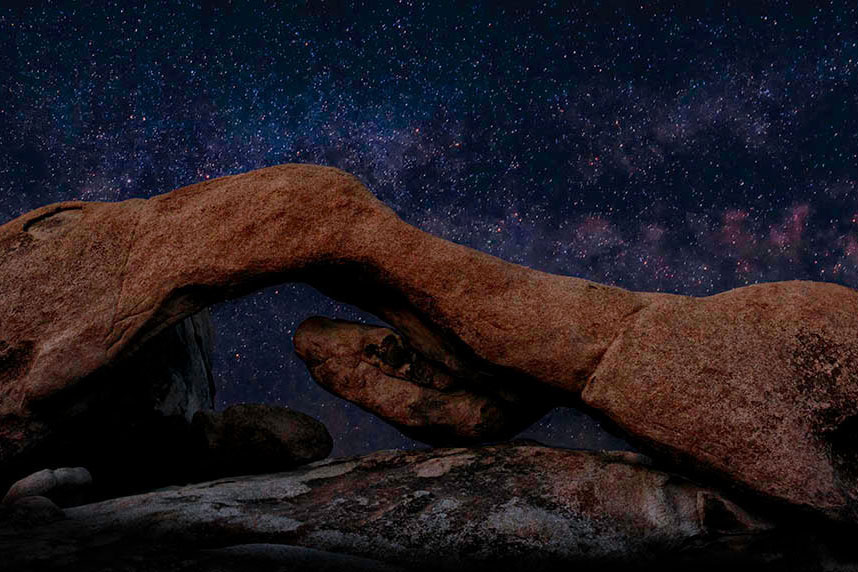 The Milky Way resting behind the Natural Arch at Joshua Tree National Park