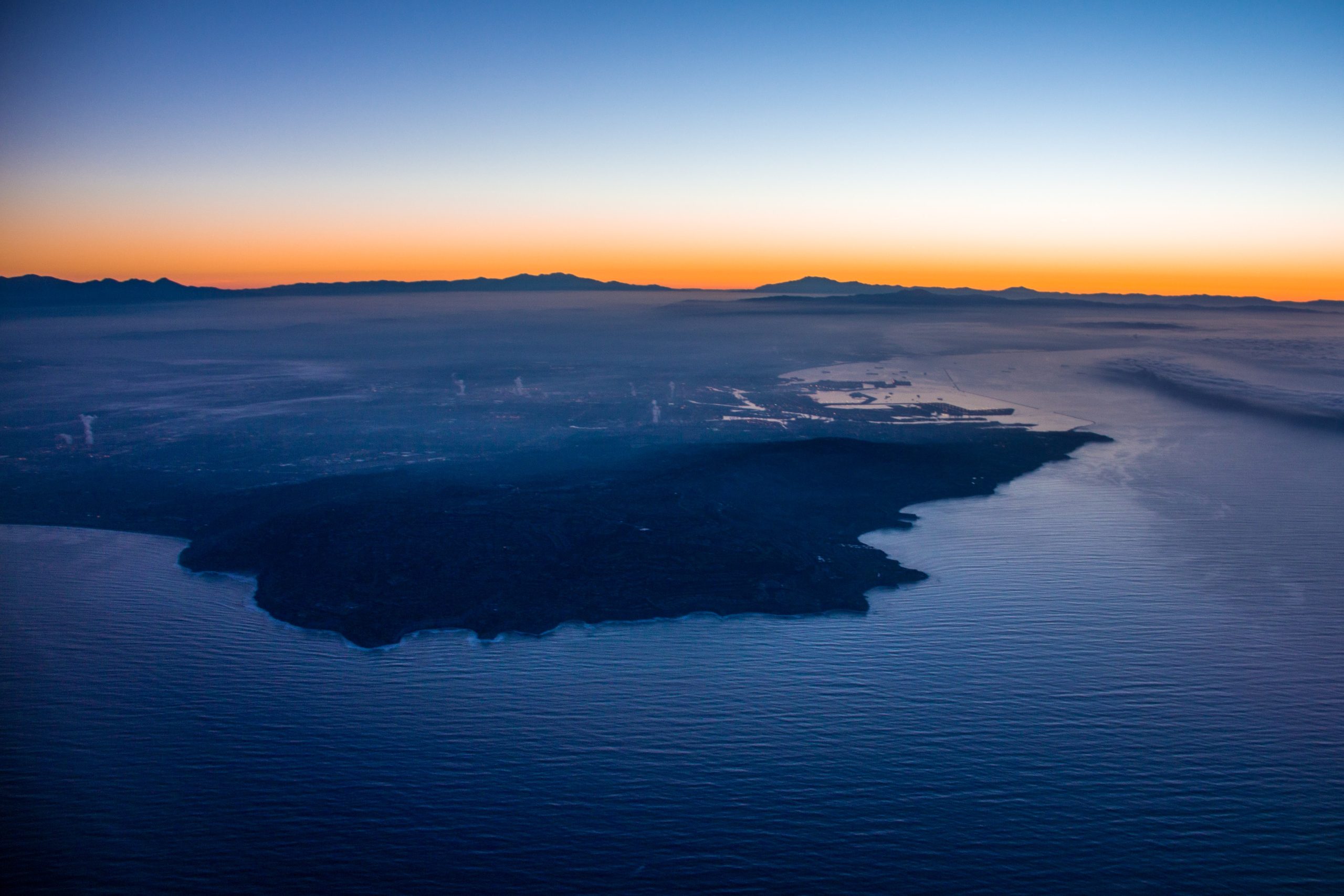 The sun rises over Signal Hill and Long Beach, California