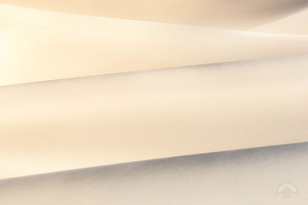Crystal clear sand forms massive dunes within Death Valley National Park.
