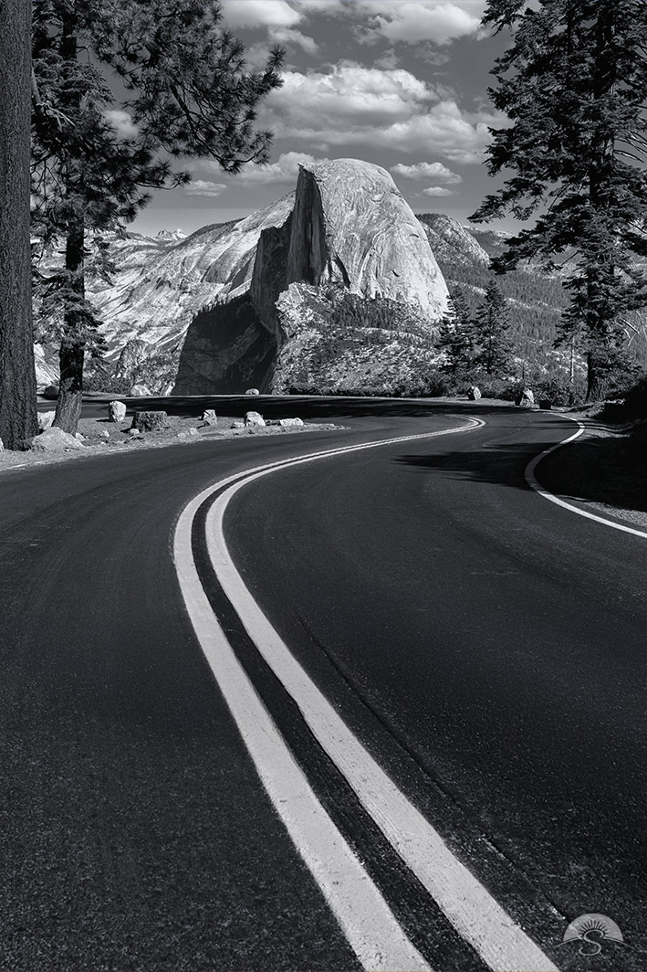A winding road marks the way to oversee Half Dome at Yosemite National Park
